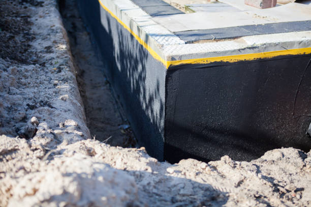 Professional Waterproofing technician working in Jackson, AL